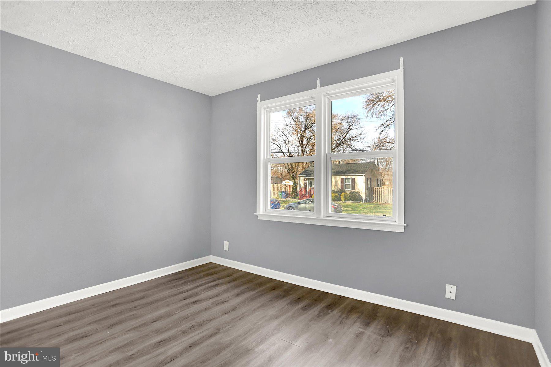 70 Swan Street Aberdeen, MD 21001 - Photo 18 of 31 a view of an empty room with wooden floor and a window