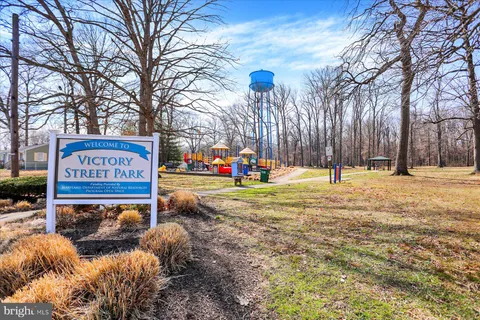 a view of yard with large trees