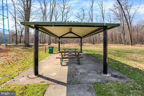 a view of a playground with basketball court