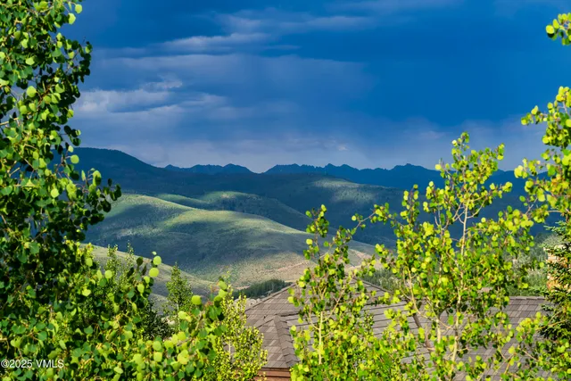 a view of a two chairs in the balcony