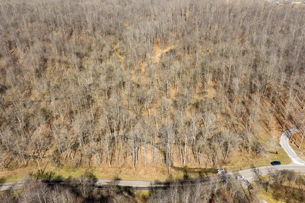 an aerial view of residential house and outdoor space