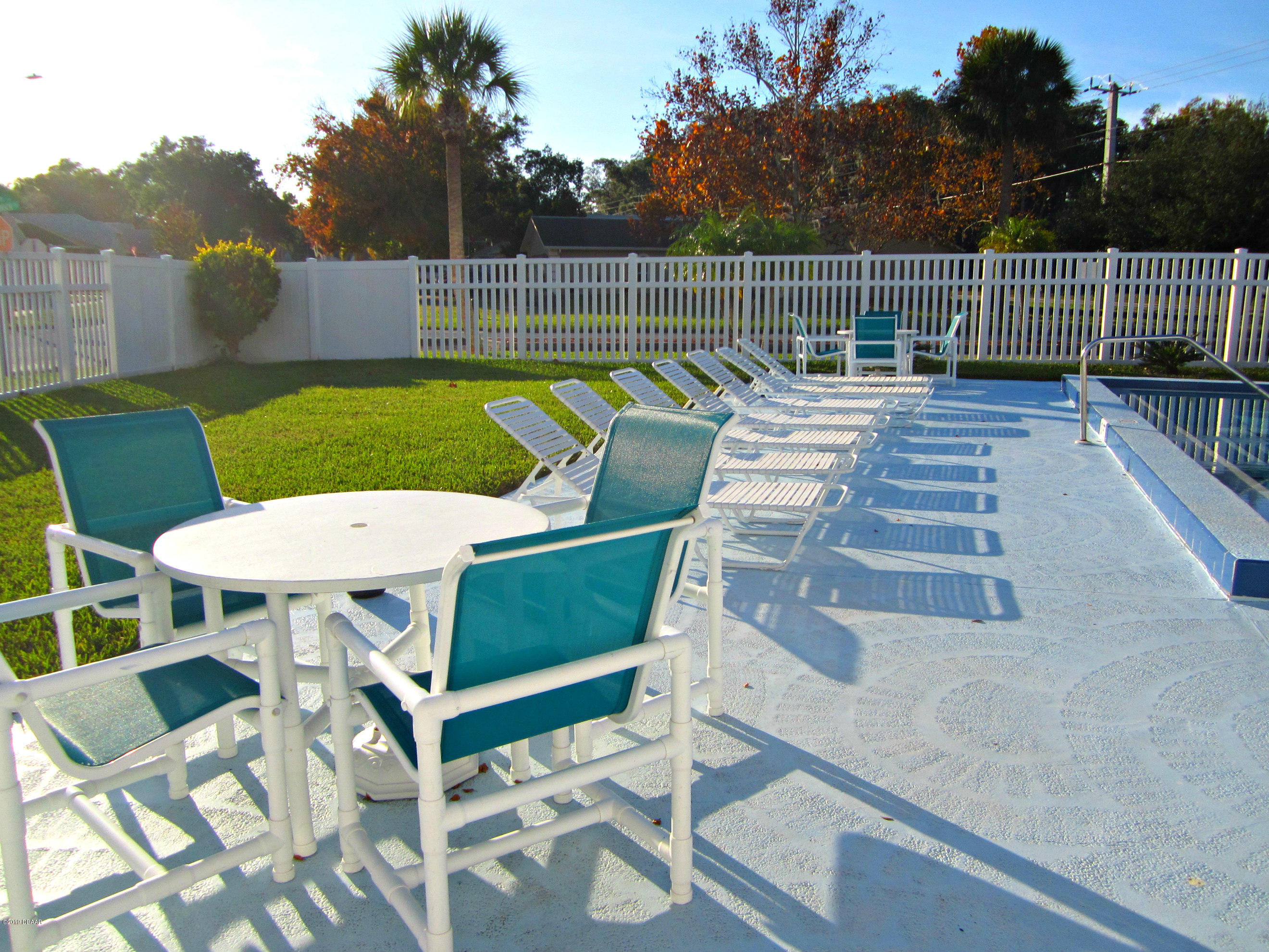 1803 Deer Springs Road Port Orange, FL 32129 - Photo 39 of 39 Pool Deck and Grassy Play Area