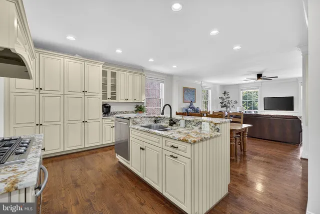 a spacious bedroom with a bed and a dresser