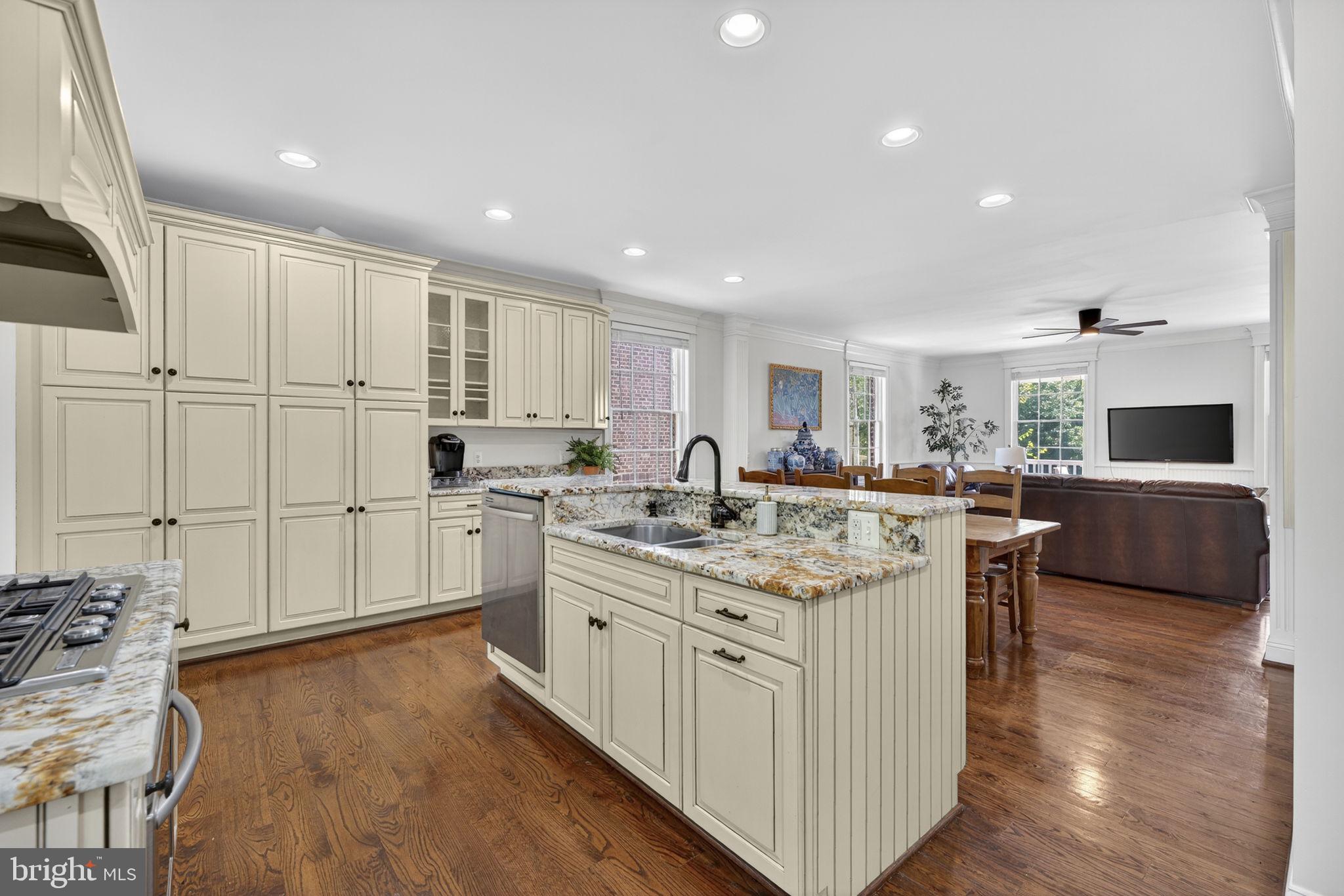 9533 Howellsville Road Boyce, VA 22620 - Photo 22 of 65 a kitchen with white cabinets sink and stainless steel appliances