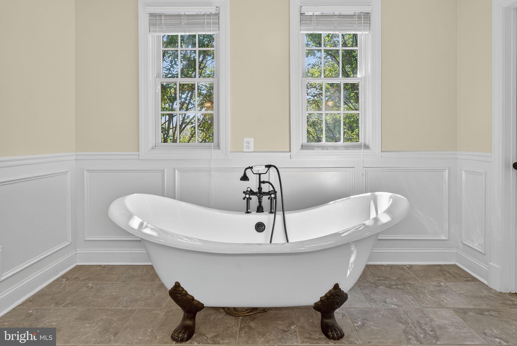 9533 Howellsville Road Boyce, VA 22620 - Photo 29 of 65 a bathroom with a sink a window and a shower