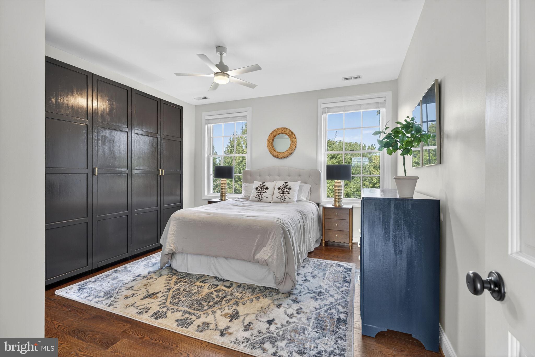 9533 Howellsville Road Boyce, VA 22620 - Photo 33 of 65 a bedroom with a large bed and a chandelier