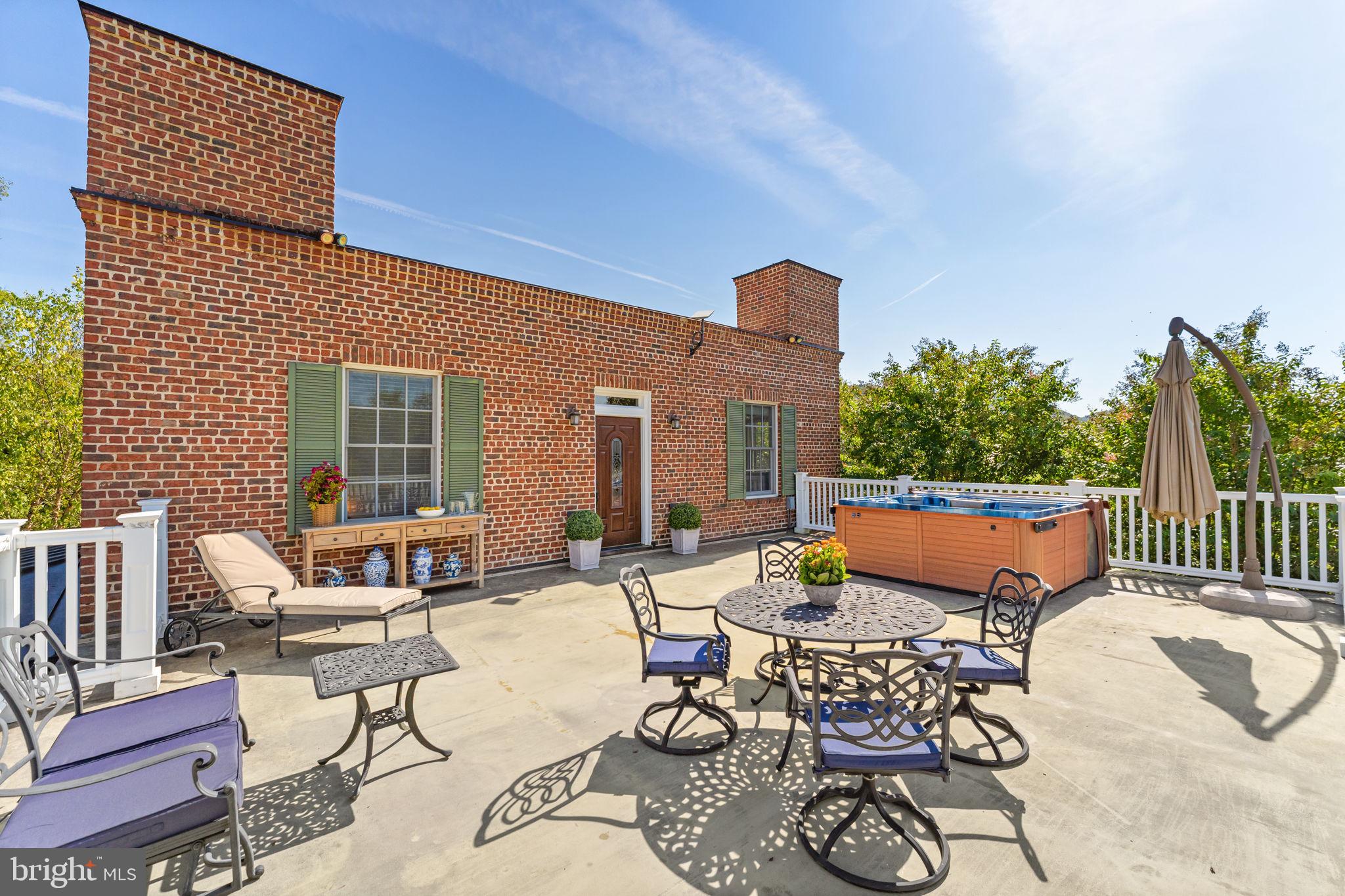 9533 Howellsville Road Boyce, VA 22620 - Photo 40 of 65 a view of a patio with couches chairs and wooden floor