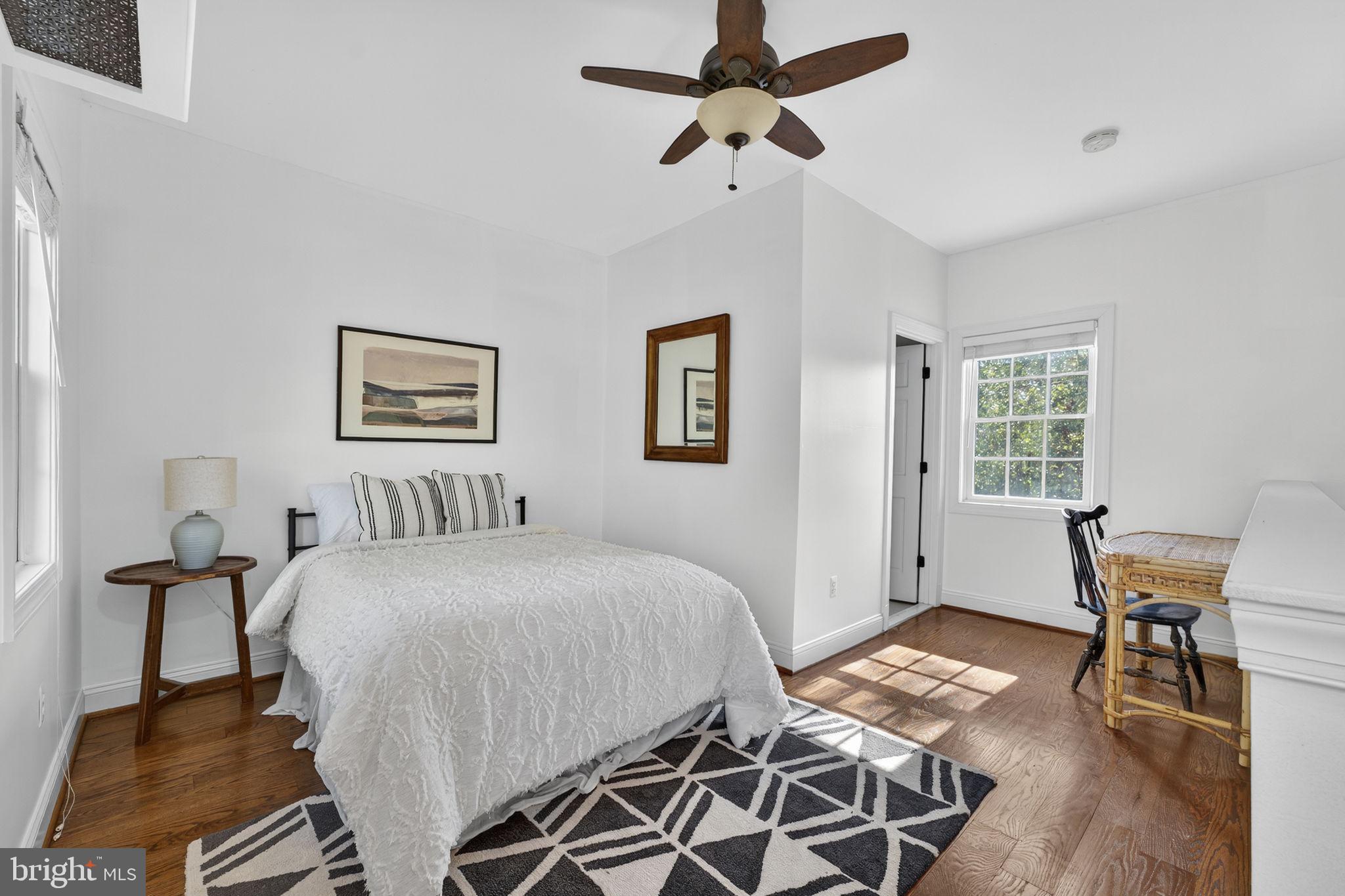 9533 Howellsville Road Boyce, VA 22620 - Photo 44 of 65 a bedroom with a bed and wooden floor