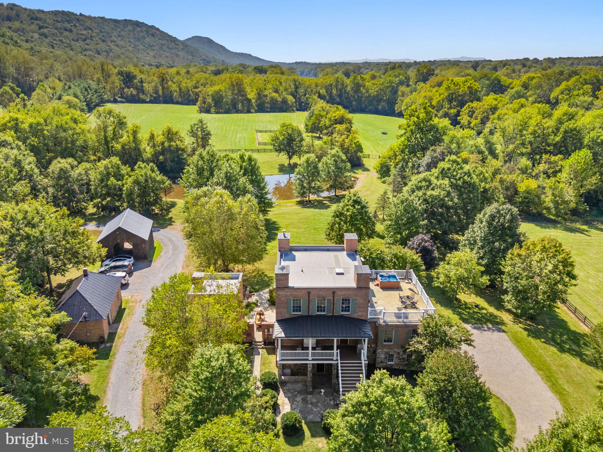 9533 Howellsville Road Boyce, VA 22620 - Photo 60 of 65 an aerial view of a house with a yard