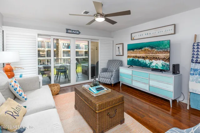 a large bed sitting in a bedroom next to a window