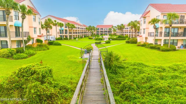 a view of a swimming pool with a garden and plants