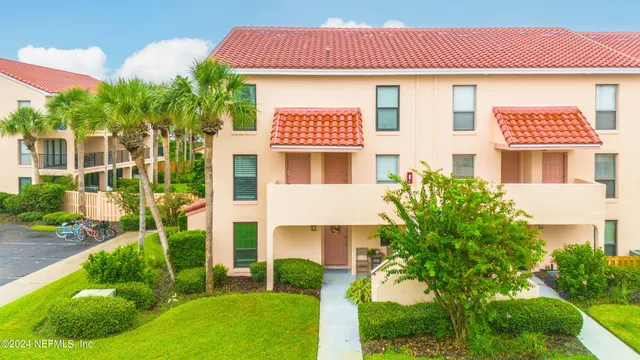 a view of a balcony with table and chairs