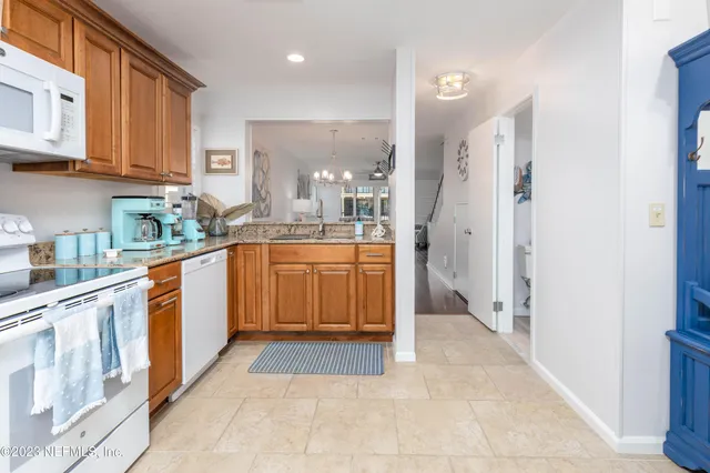 a kitchen with stainless steel appliances granite countertop a sink and cabinets
