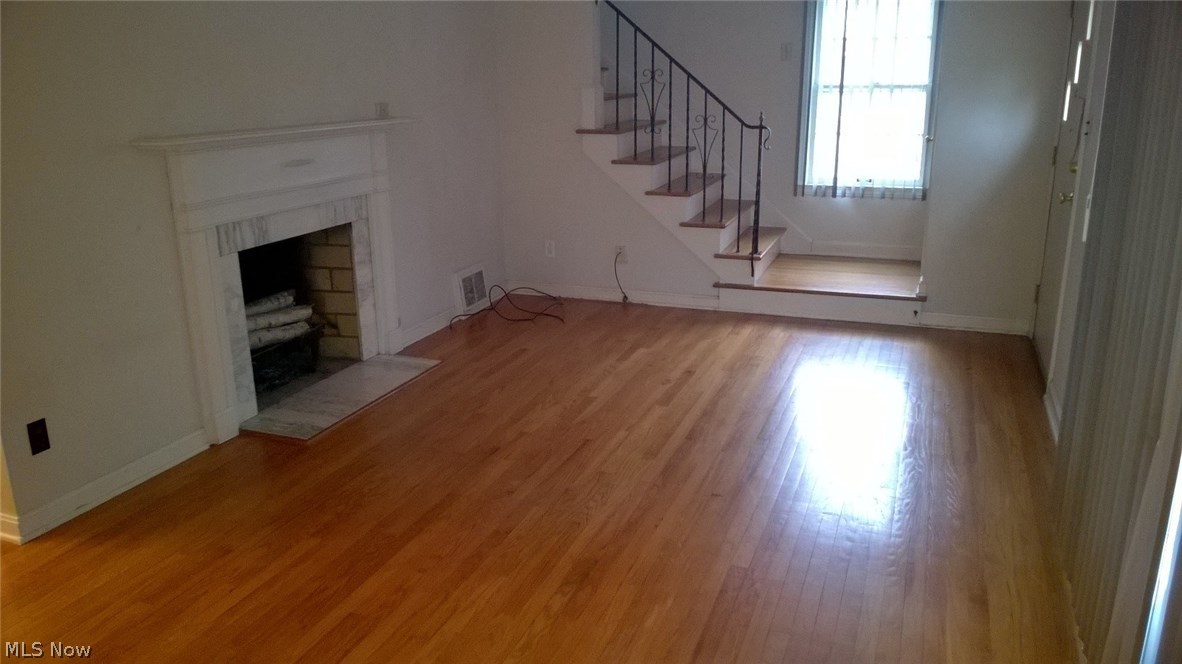 1189 Avondale Road Cleveland, OH 44121 - Photo 3 of 19 Gleaming hardwood floors through 1st and 2nd levels! Woodburning fireplaces in livingroom and basement rec room