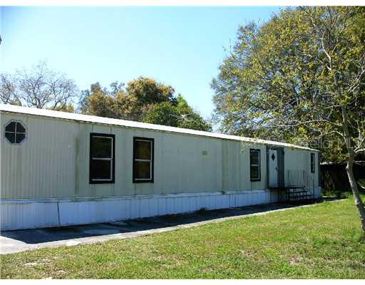 6012 Williams Road Seffner, FL 33584 - Photo 1 of 1 a front view of a house with a yard