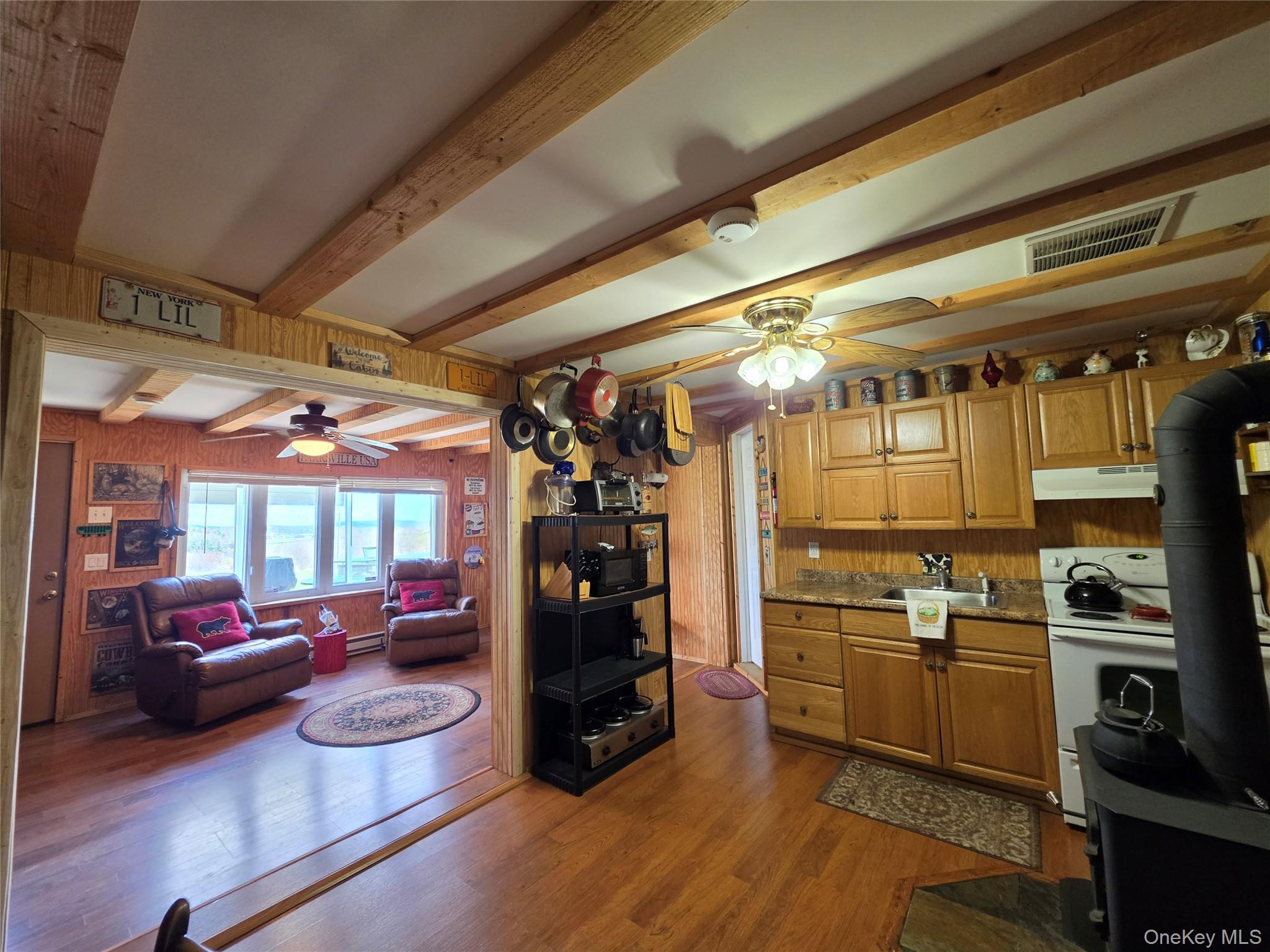 48 Mullen Road Parksville, NY 12768 - Photo 12 of 35 a kitchen with a refrigerator and a view of living room