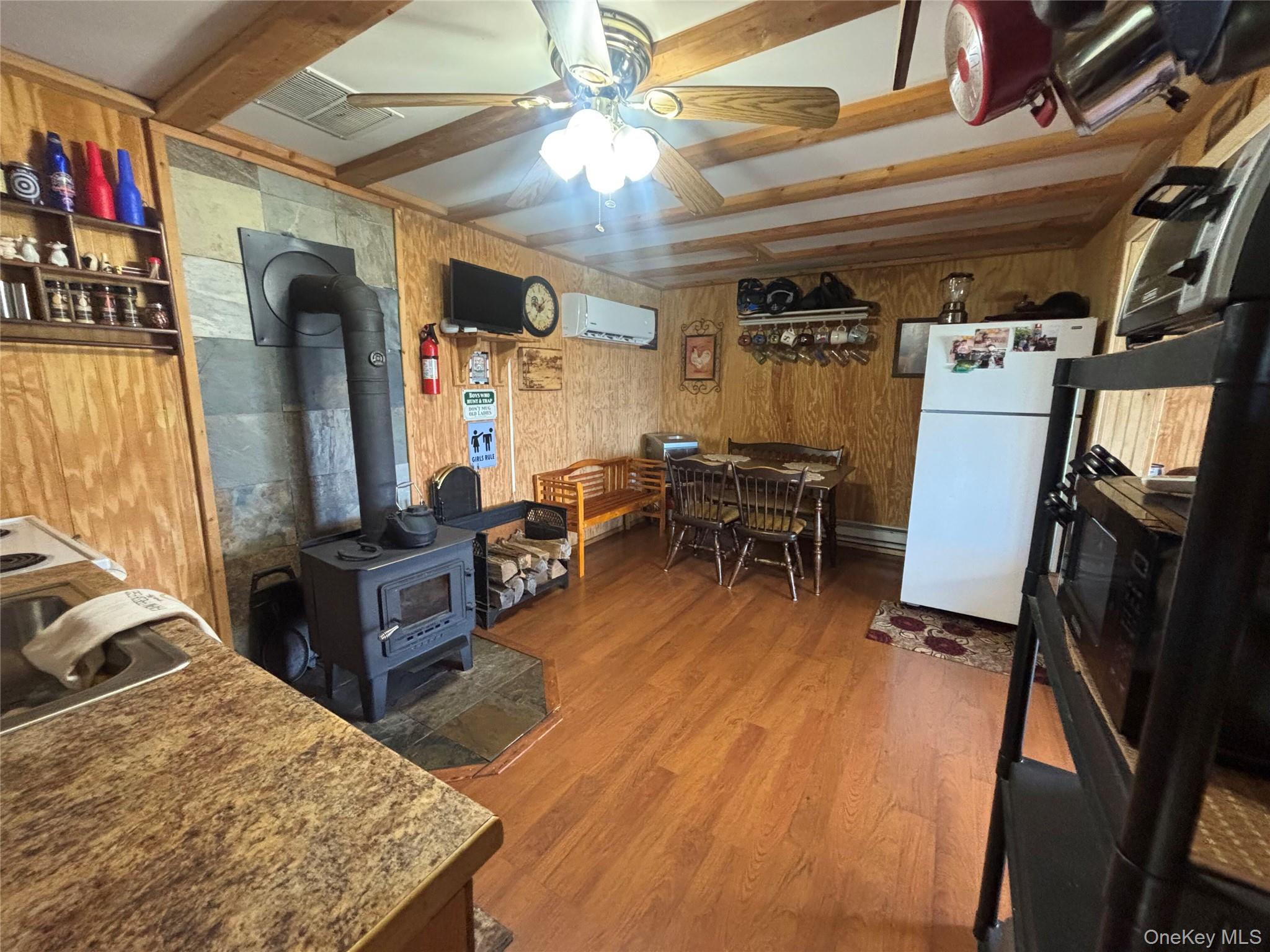 48 Mullen Road Parksville, NY 12768 - Photo 14 of 35 a living room with lots of furniture and a flat screen tv
