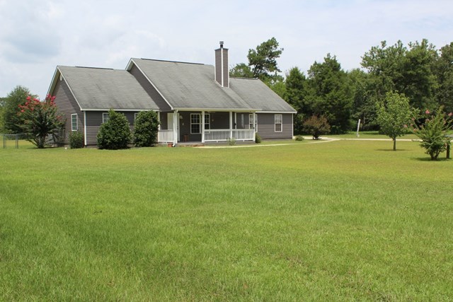 7164 Goodall Mill Road Macon, GA 31216 - Photo 3 of 12 a front view of a house with a garden