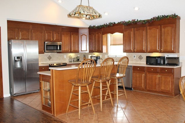7164 Goodall Mill Road Macon, GA 31216 - Photo 7 of 12 a kitchen with stainless steel appliances a refrigerator and microwave
