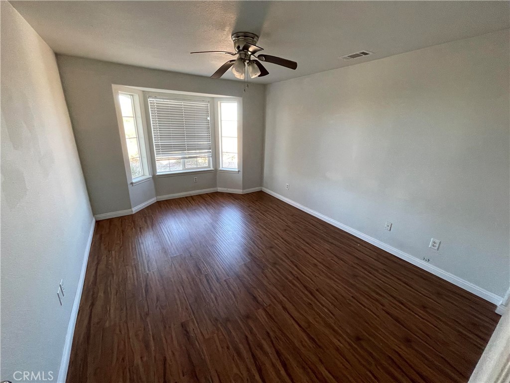 8354 White Road Phelan, CA 92371 - Photo 10 of 43 wooden floor in an empty room with a window