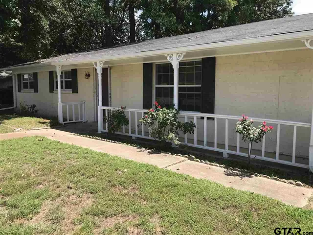 a front view of a house having yard