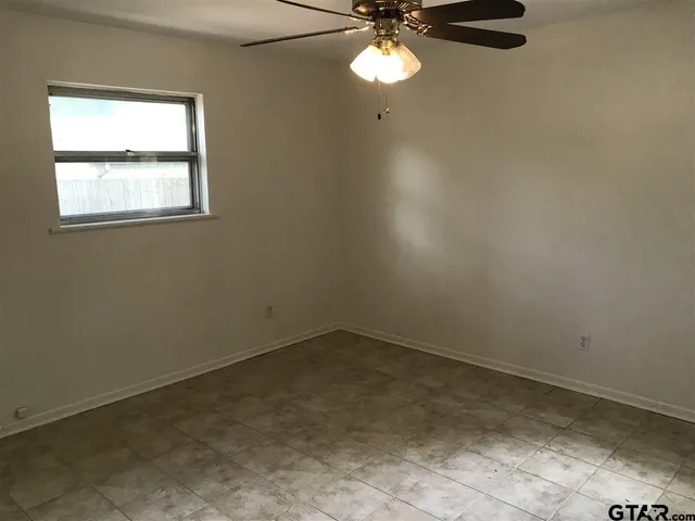 a white toilet sitting next to a shower