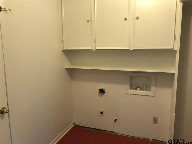 a wooden bench sitting in front of a house