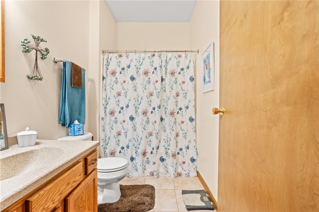 4222 Ramsey Road Springfield, OH 45502 - Photo 61 of 79 This bright bathroom features ample counter space and a tiled shower area.
