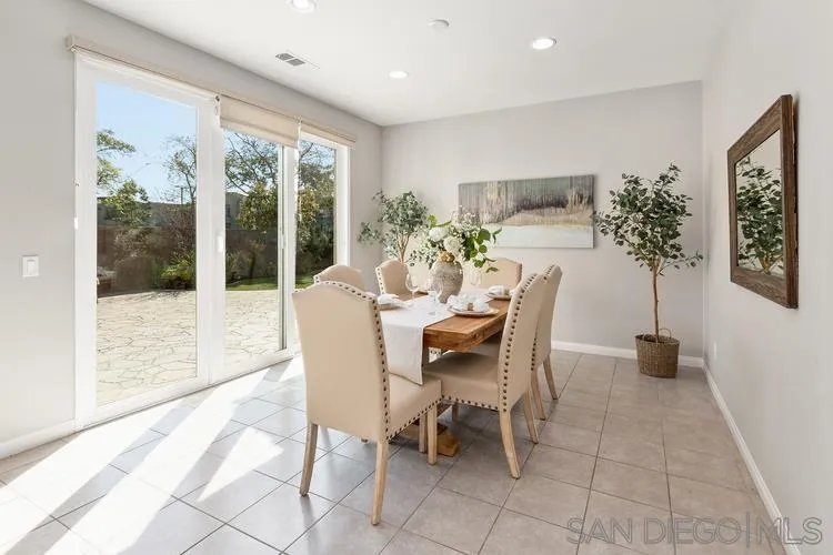 16697 Nicole Ridge Road San Diego, CA 92127 - Photo 8 of 34 a dining room with furniture and a floor to ceiling window