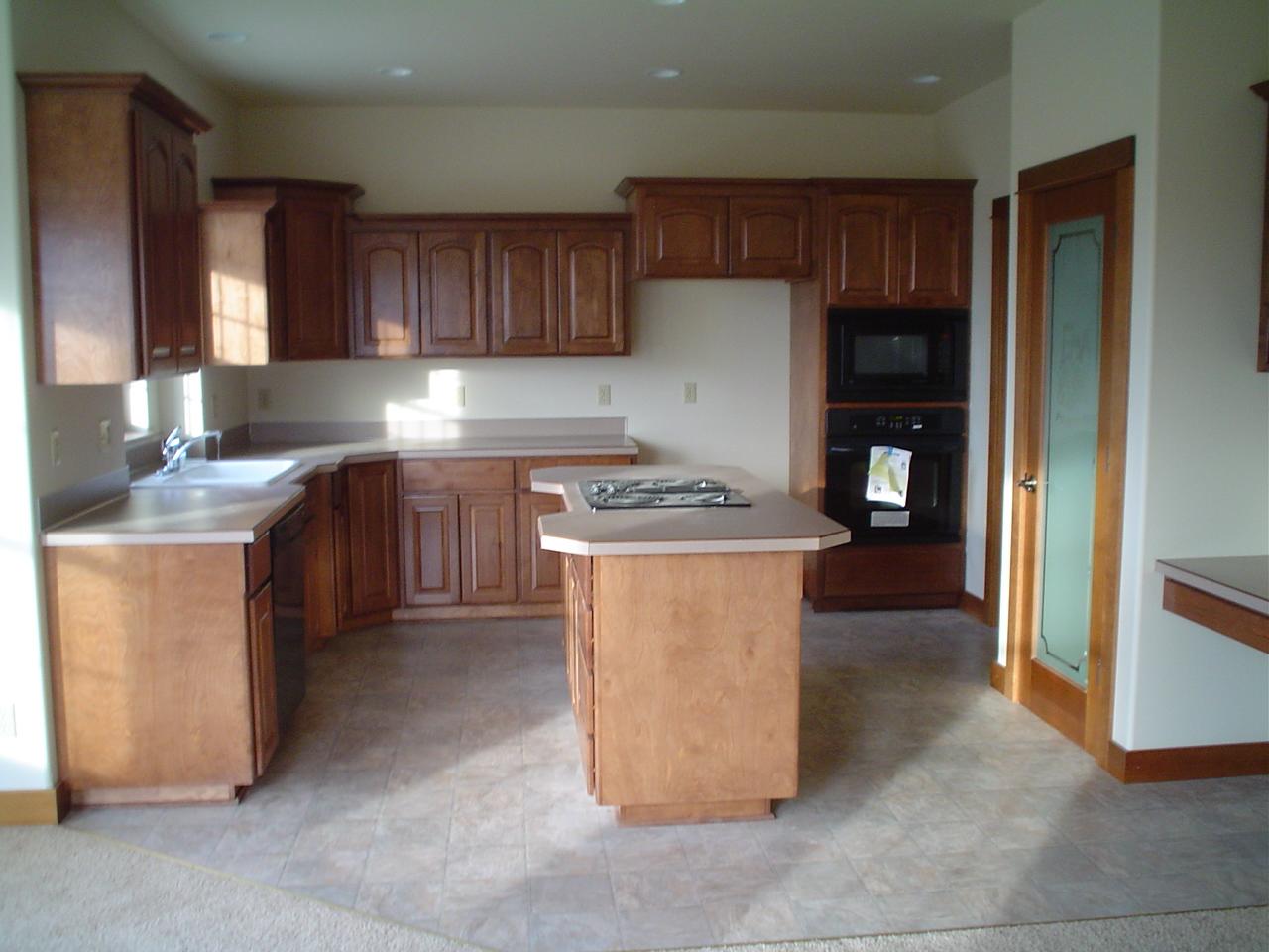 3141 Scoon Road Sunnyside, WA 98944 - Photo 3 of 9 a kitchen with stainless steel appliances granite countertop a stove top oven a sink and a refrigerator