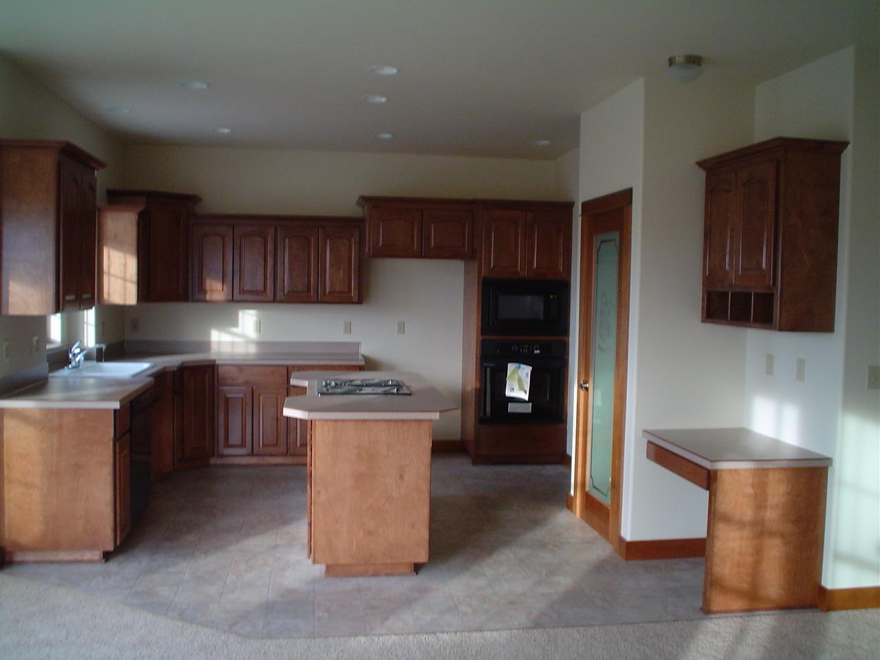 3141 Scoon Road Sunnyside, WA 98944 - Photo 4 of 9 a kitchen with a stove top oven and cabinets