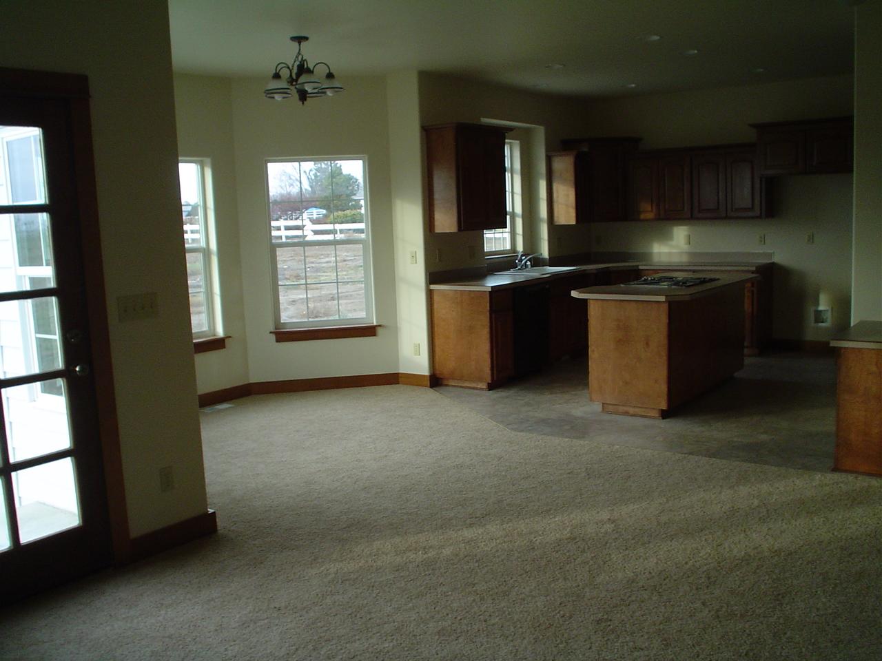3141 Scoon Road Sunnyside, WA 98944 - Photo 5 of 9 a kitchen with stainless steel appliances granite countertop a stove a sink and a refrigerator