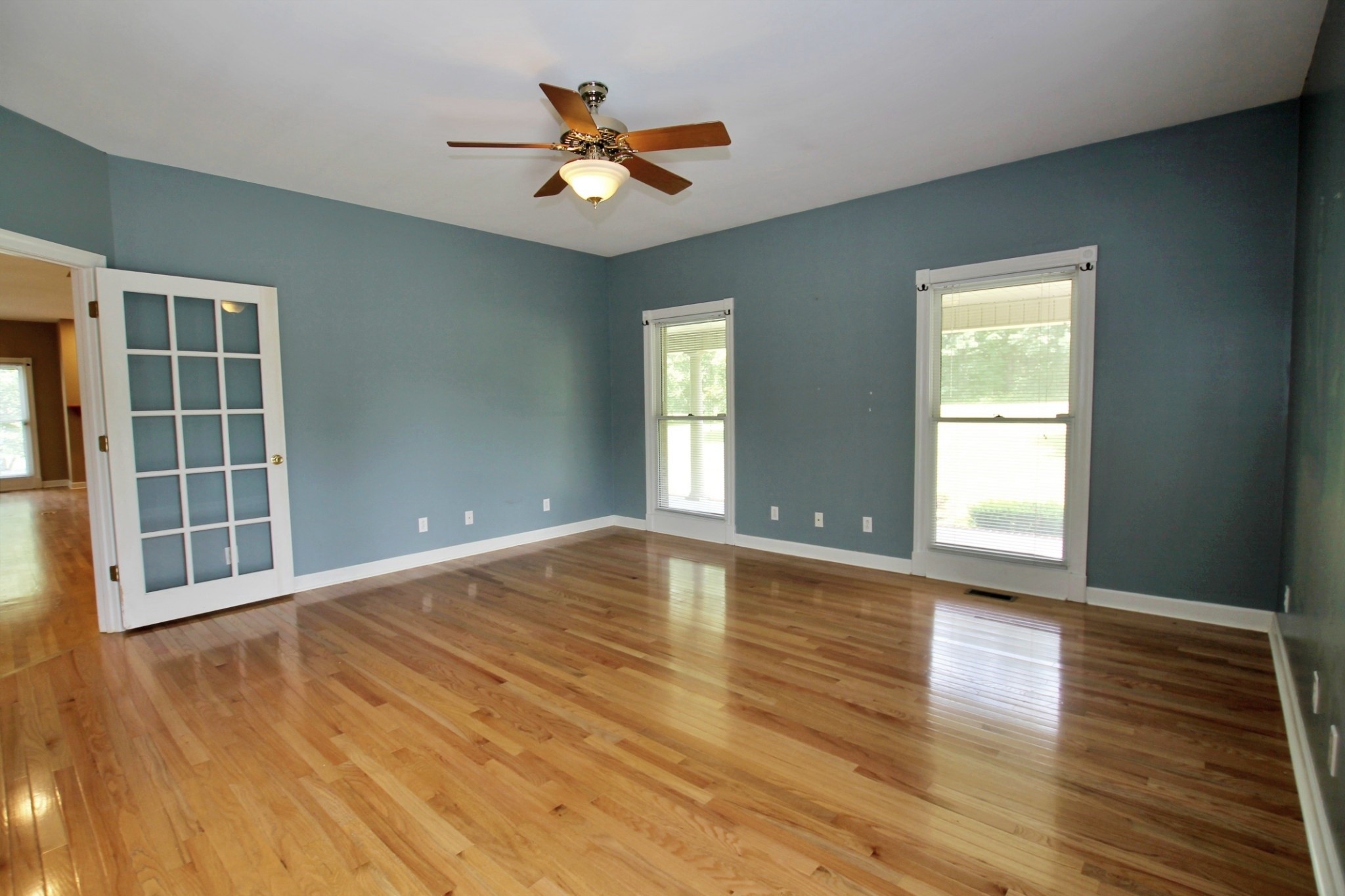 4181 Sandy Springs Road Springfield, TN 37172 - Photo 11 of 44 a view of an empty room with a window and wooden floor