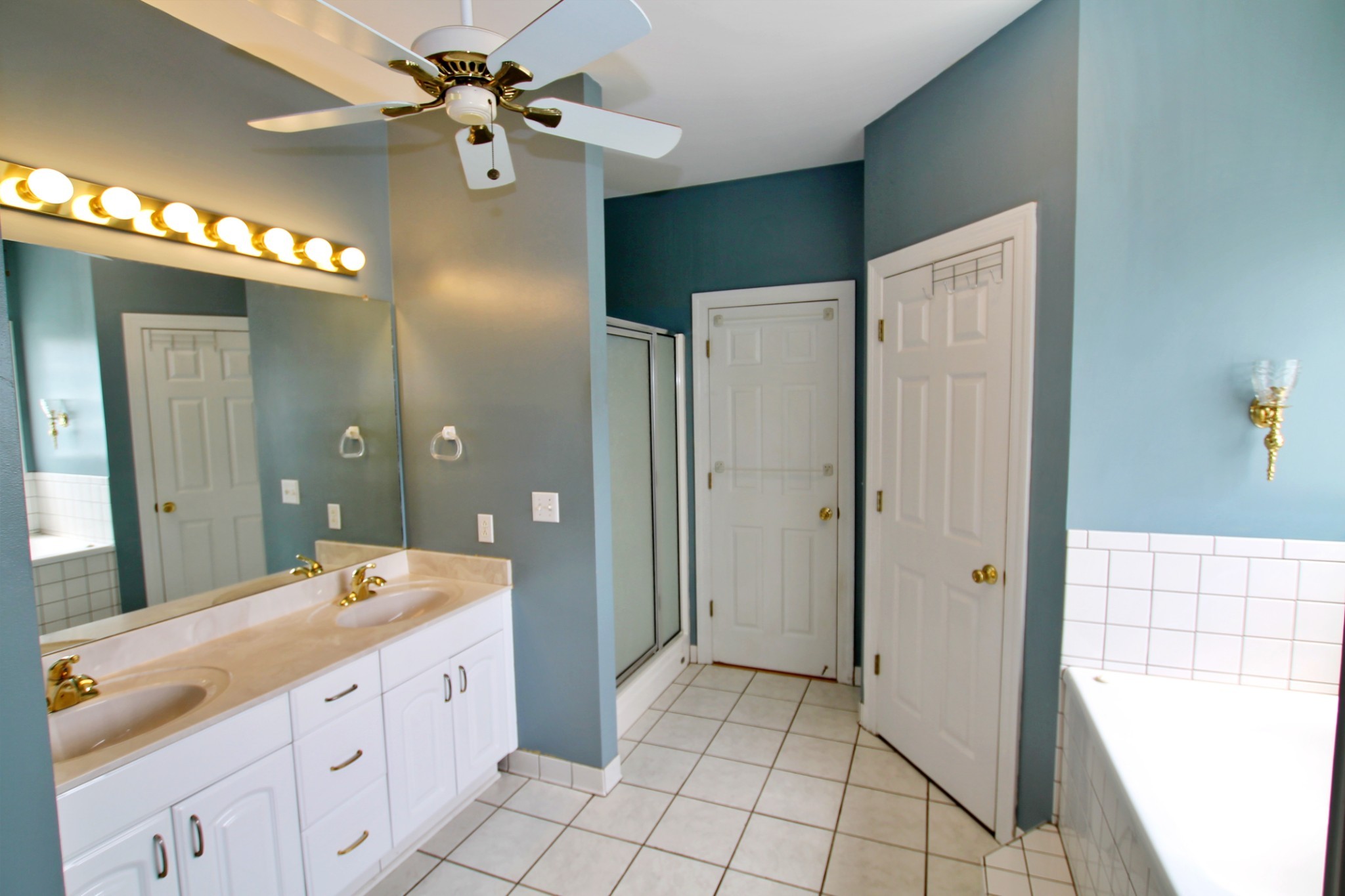 4181 Sandy Springs Road Springfield, TN 37172 - Photo 14 of 44 a spacious bathroom with a double vanity sink shower and a mirror