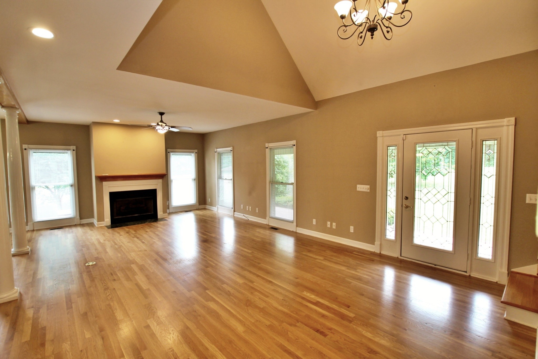 4181 Sandy Springs Road Springfield, TN 37172 - Photo 4 of 44 a view of an empty room with wooden floor and a fireplace