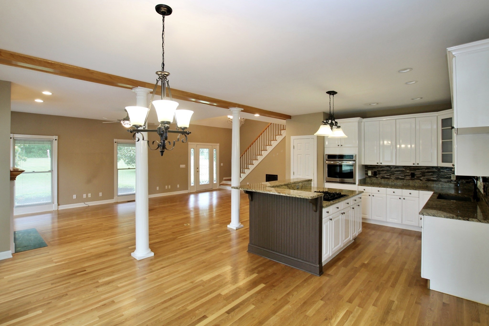 4181 Sandy Springs Road Springfield, TN 37172 - Photo 6 of 44 a kitchen with stainless steel appliances granite countertop a sink a stove and a wooden floor