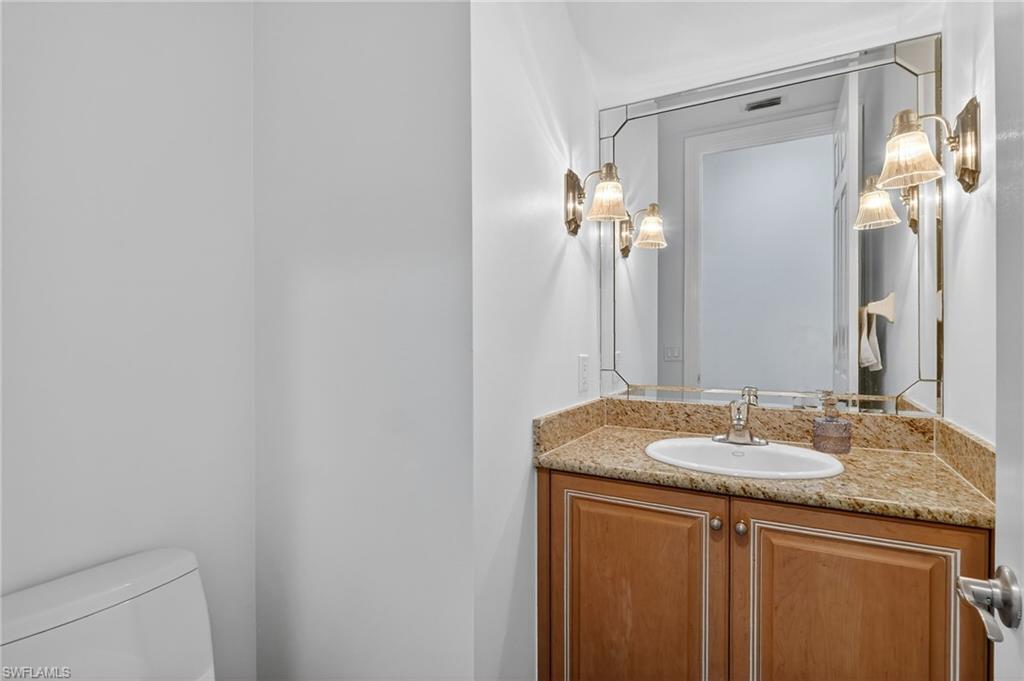 2234 Campestre Terrace Naples, FL 34119 - Photo 18 of 48 Half bathroom featuring vanity and toilet