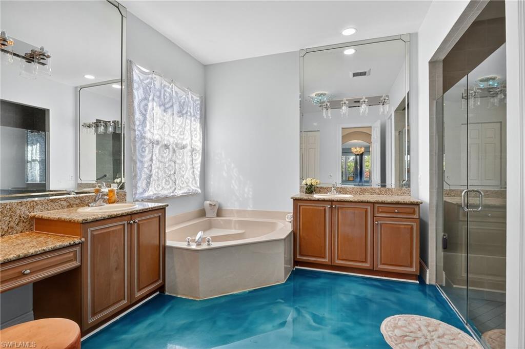 2234 Campestre Terrace Naples, FL 34119 - Photo 20 of 48 Bathroom featuring a stall shower, two vanities, a bath, and recessed lighting