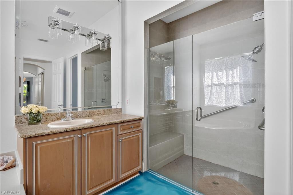 2234 Campestre Terrace Naples, FL 34119 - Photo 21 of 48 Bathroom with vanity and a stall shower
