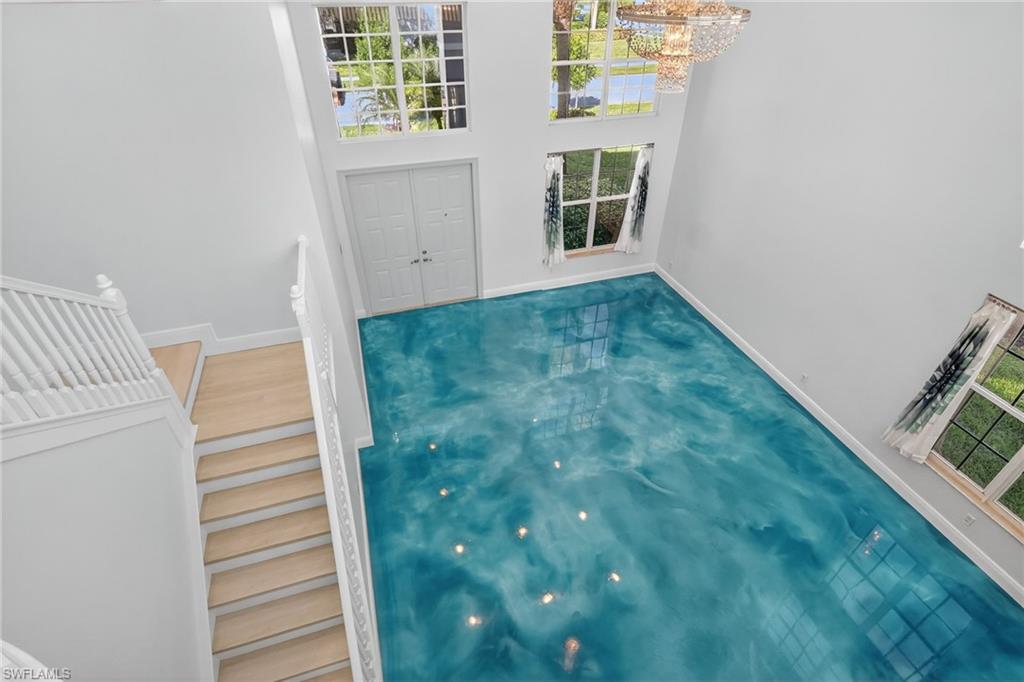 2234 Campestre Terrace Naples, FL 34119 - Photo 30 of 48 View of pool with a chandelier