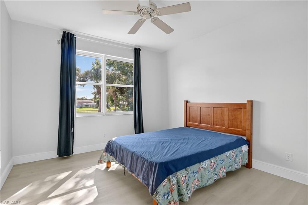 2234 Campestre Terrace Naples, FL 34119 - Photo 34 of 48 Bedroom featuring light wood-style floors and ceiling fan
