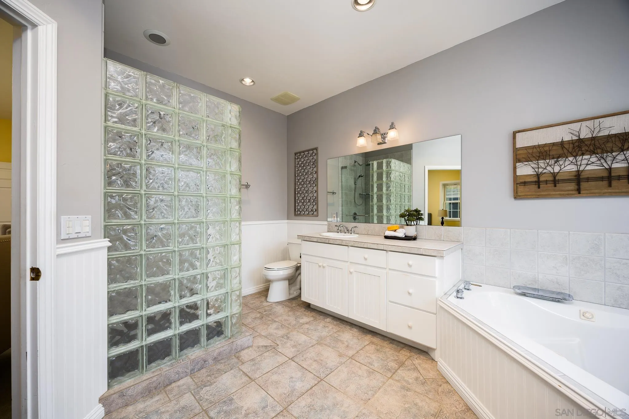 7570 Corte Madera Road Pine Valley, CA 91962 - Photo 15 of 53 a spacious bathroom with a double vanity sink a mirror and a bathtub