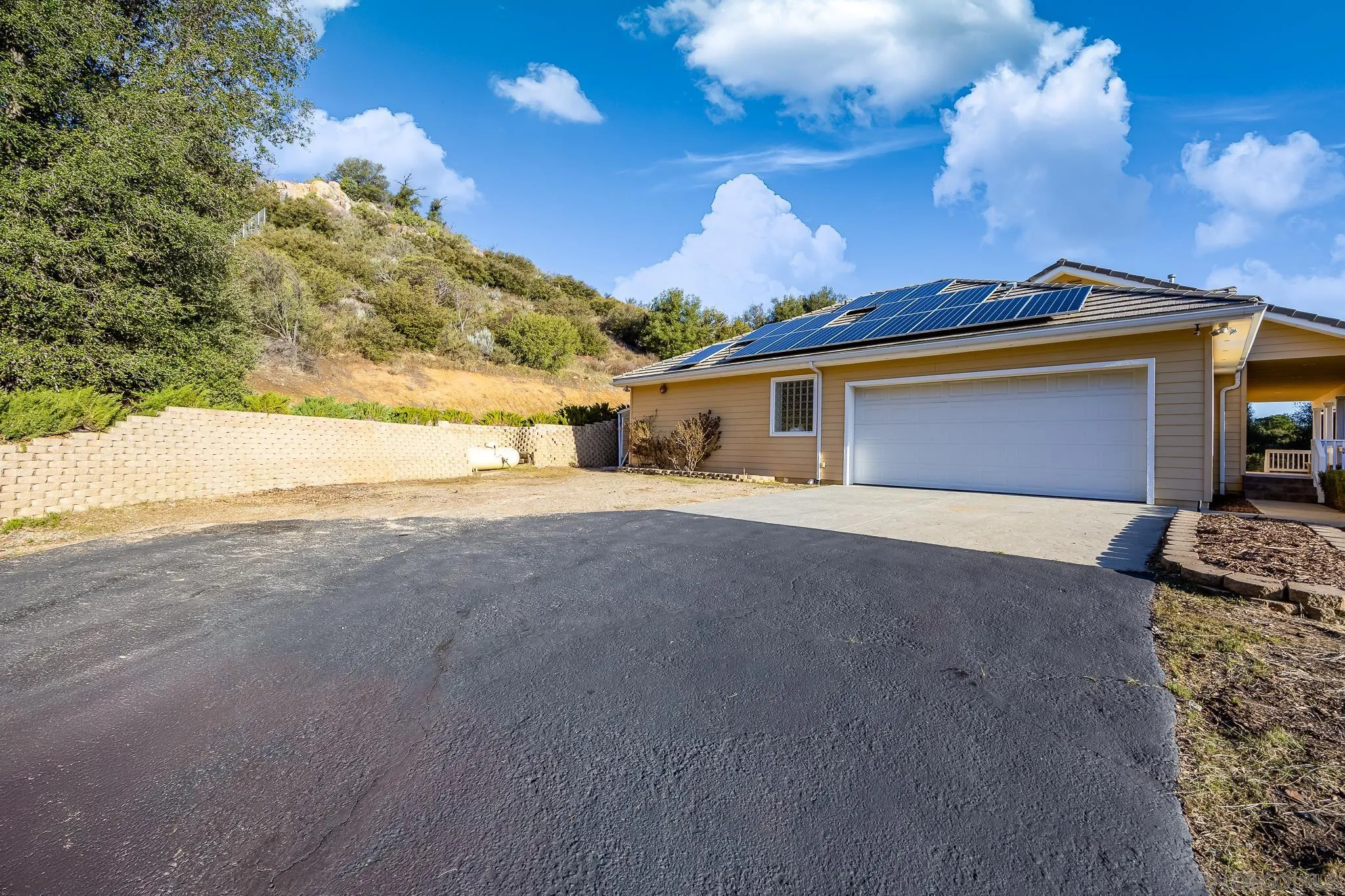 7570 Corte Madera Road Pine Valley, CA 91962 - Photo 32 of 53 a view of a house with a yard