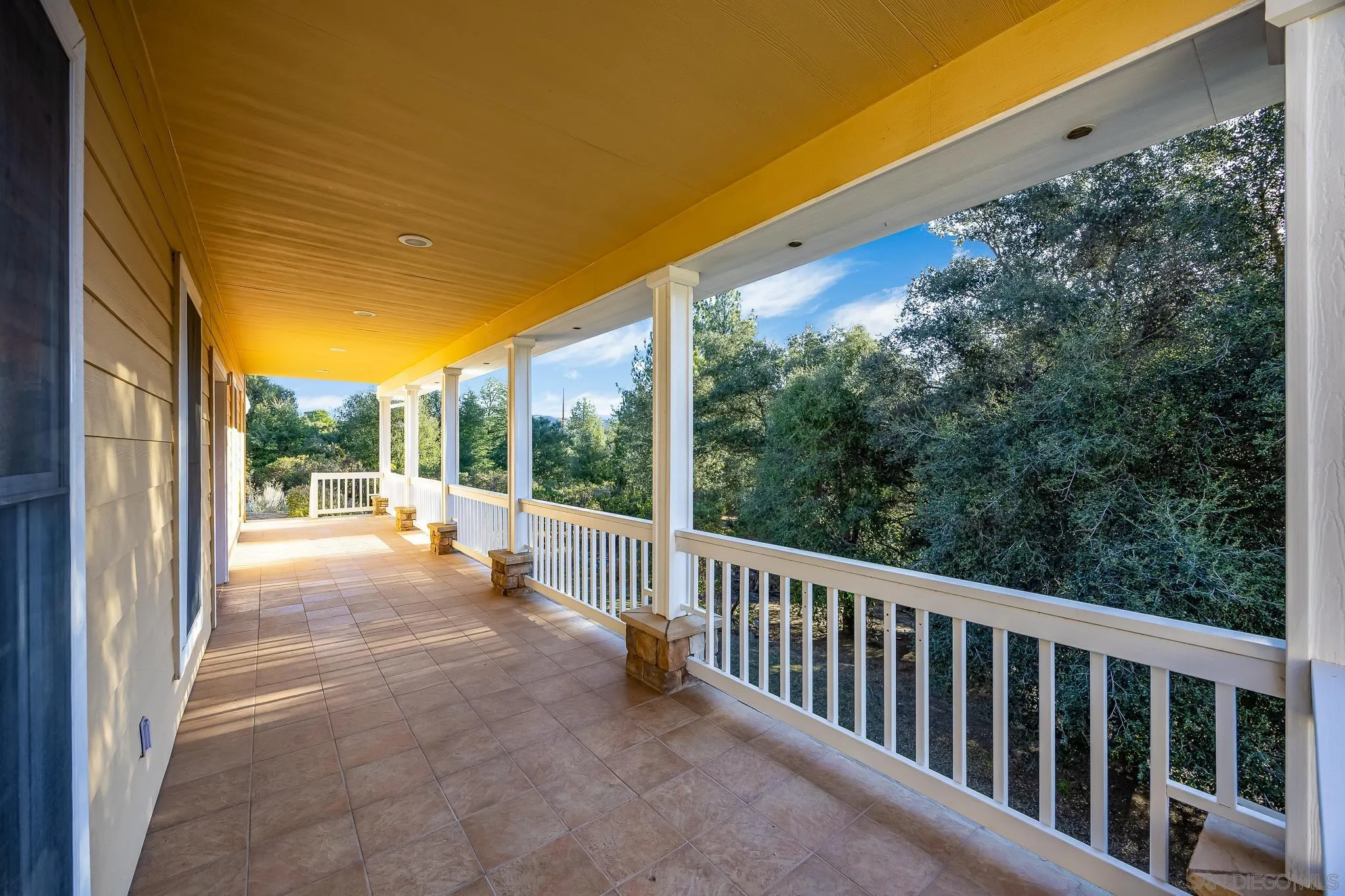 7570 Corte Madera Road Pine Valley, CA 91962 - Photo 35 of 53 a view of balcony with floor to ceiling window and wooden floor