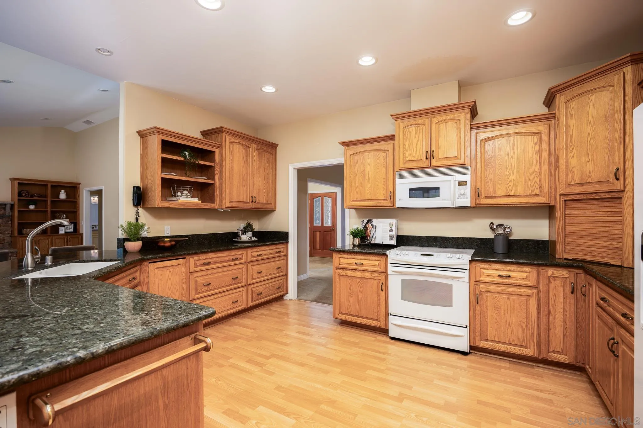 7570 Corte Madera Road Pine Valley, CA 91962 - Photo 9 of 53 a kitchen with stainless steel appliances granite countertop a stove sink and cabinets