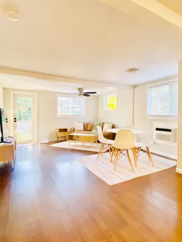 a living room with furniture and a table
