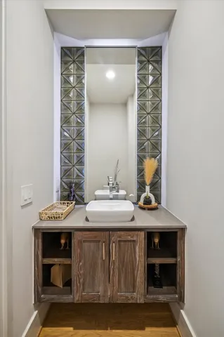 a bathroom with a sink and a mirror