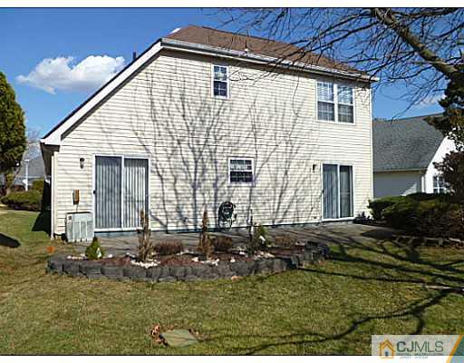 116 Almond Road Freehold, NJ 07728 - Photo 2 of 14 a front view of a house with a yard