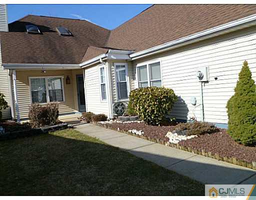 116 Almond Road Freehold, NJ 07728 - Photo 11 of 14 a front view of a house with garden