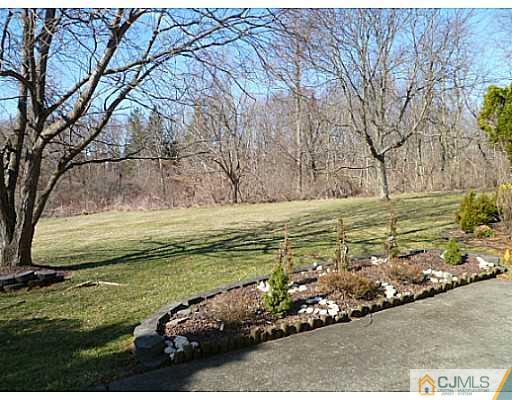 116 Almond Road Freehold, NJ 07728 - Photo 13 of 14 a view of a bench in a yard